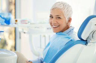 cheerfuls woman sitting in dental chair sedation dentistry dentist in Tulsa Oklahoma
